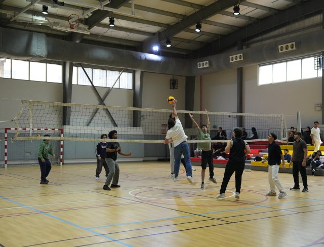 RAKMHSU students playing volleyball in the Sports Complex hall