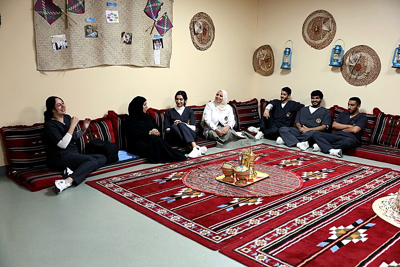 RAKMHSU students from several nationalities sitting together in the campus majlis